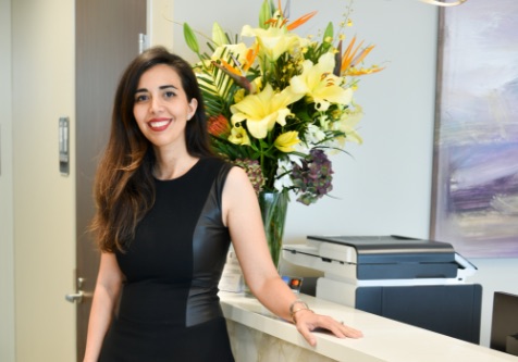 Dr. Harirchian standing near a counter