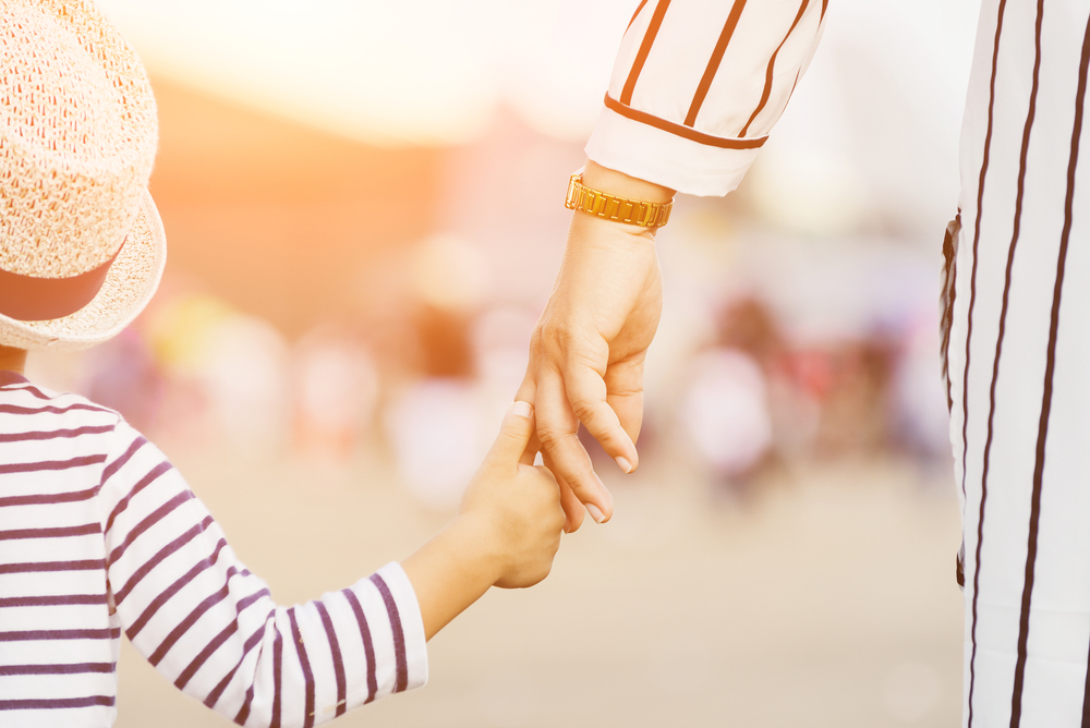 mother and child holding hands